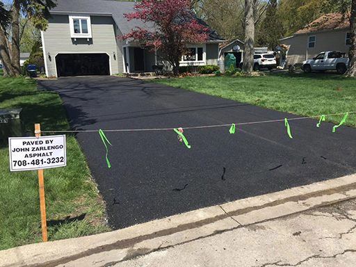 Residential driveway asphalt paving in Country Club Hills, Illinois by John Zarlengo Asphalt Paving