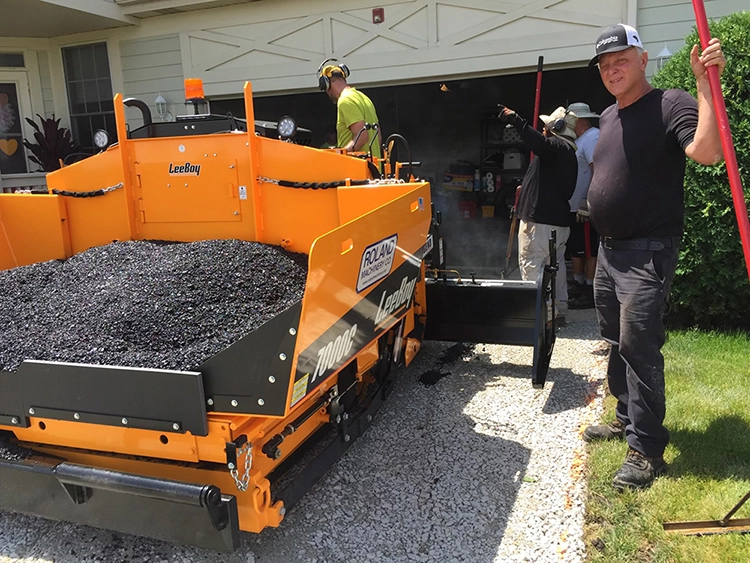 John Zarlengo Asphalt Paving crew working with paving machine on residential driveway